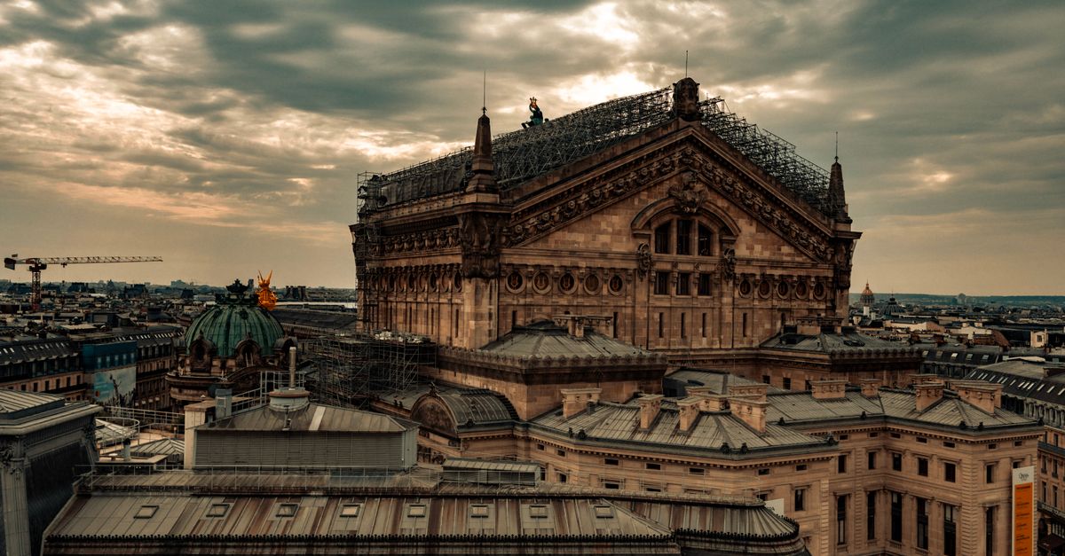 Aerial view of Paris' historic Opera building with stunning sunset light.